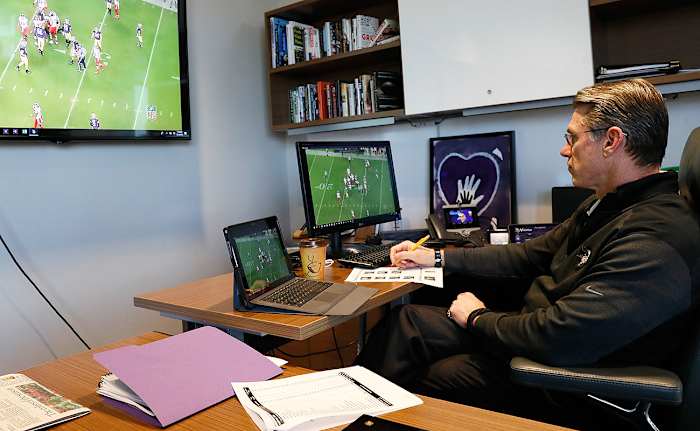 GM Rick Spielman cues up tape in his office.